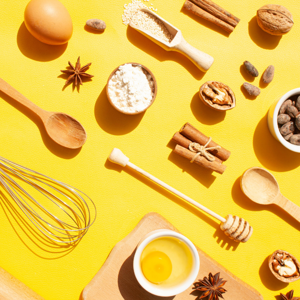 a group of kitchen items on a yellow background