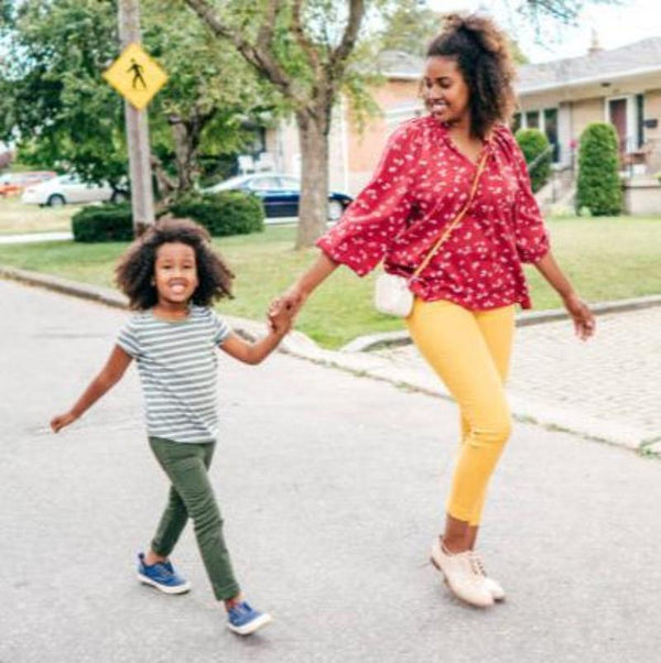 a mom and daughter taking a walk