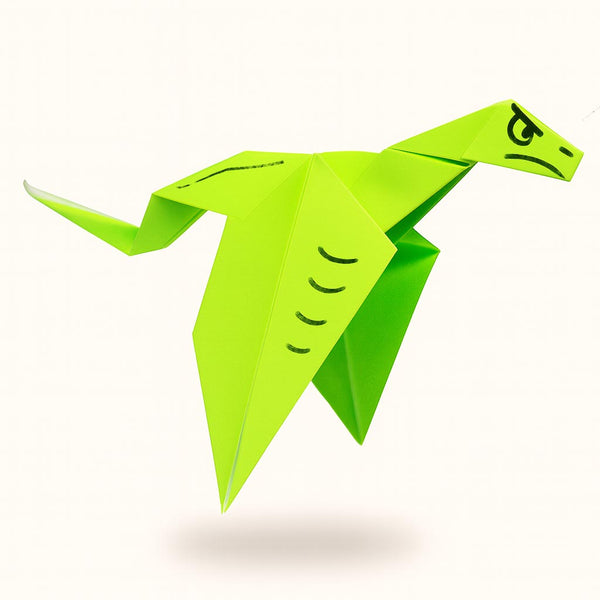 Green origami dinosaur on a white background