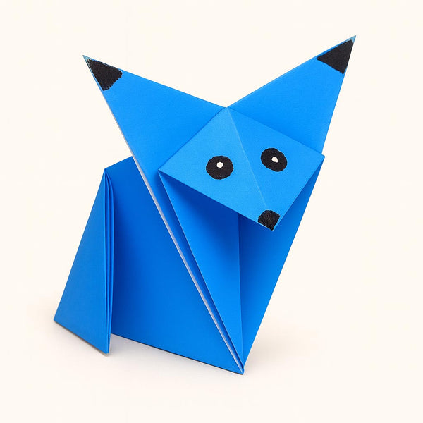 Blue origami fox on a white background